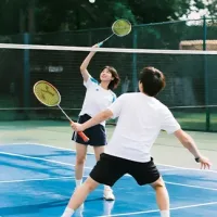Couple playing badminton outdoor active sport healthy lifestyle - bterlif supplement