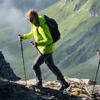 Man hiking mountain trail outdoor adventure endurance - bterlif health supplement